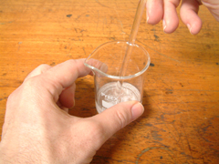 The solid is carefully dissolved ensuring no losses