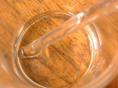 The beaker contents are checked for complete solution